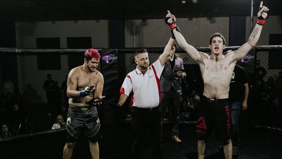 Victory: Grant Brechney after defeating his opponent.