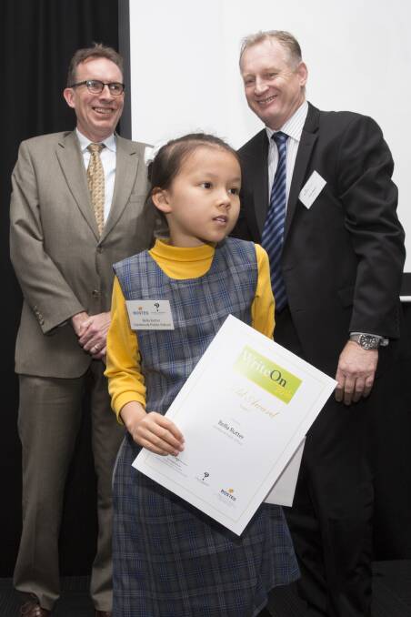 Author in the making: Bella Rutter with her award, while Richard Neville - Mitchell librarian and director, education and scholarships and Paul Hewitt, the executive director, curriculum, teaching and assessment at BOSTES look on. 