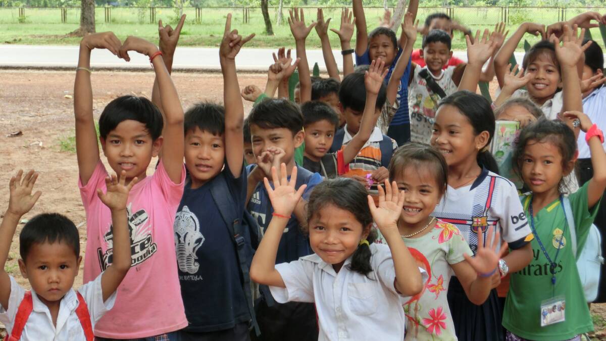 Loving school: Students in the playground of the bush school in Cambodia.
