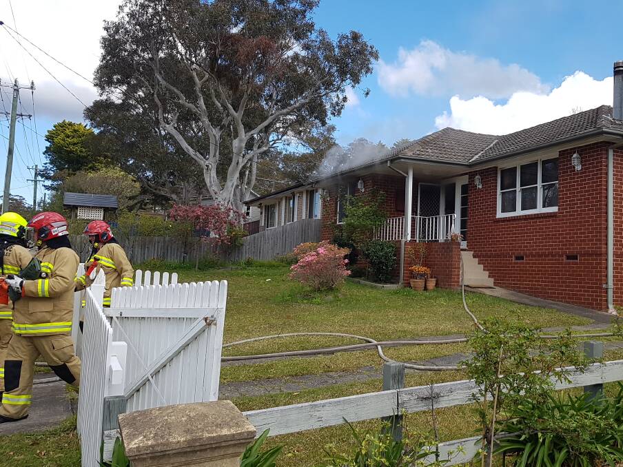 House fire: Smoke was seen coming from the Lawson home on Saturday. Photo: Top Notch Video