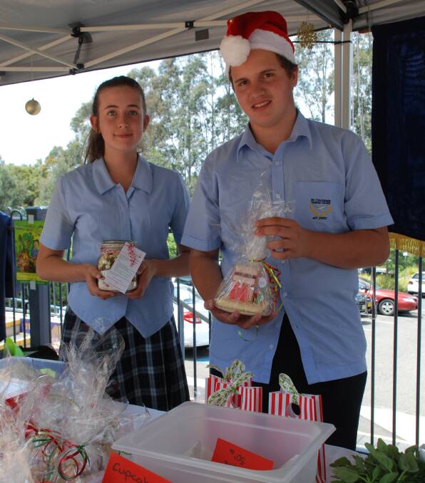 Annabel Ward and Nick Hibbard kept the Christmas goodies table well-stocked.