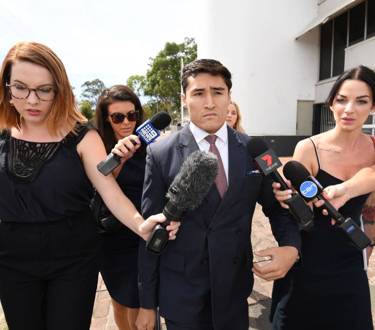 At Penrith Local Court: Lawyer Bryan Wrench (centre), representing the four adults, leaves the court on February 16. Photo: AAP Image/Peter Rae