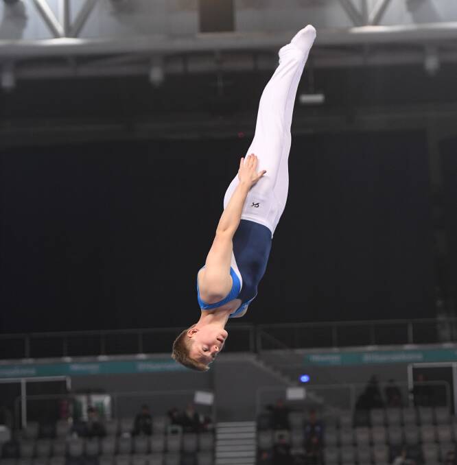 Flying high: Winmalee gymnast Justin Fokes representing NSW at the age nationals in June. He also won three medals at last week's National Clubs Gymnastics Carnival.