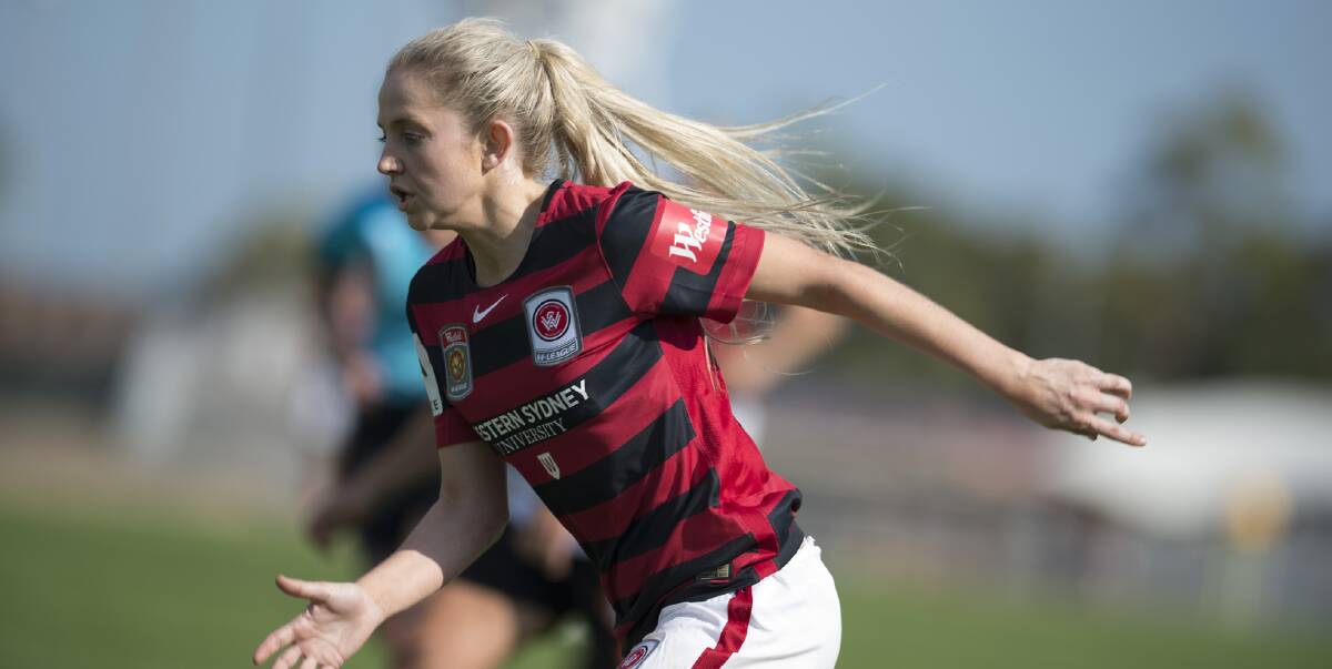 Nursing before football: Western Sydney Wanderers W-League player Linda O'Neill chases the ball down last season. She has hung up the boots after five seasons with the Wanderers. 
