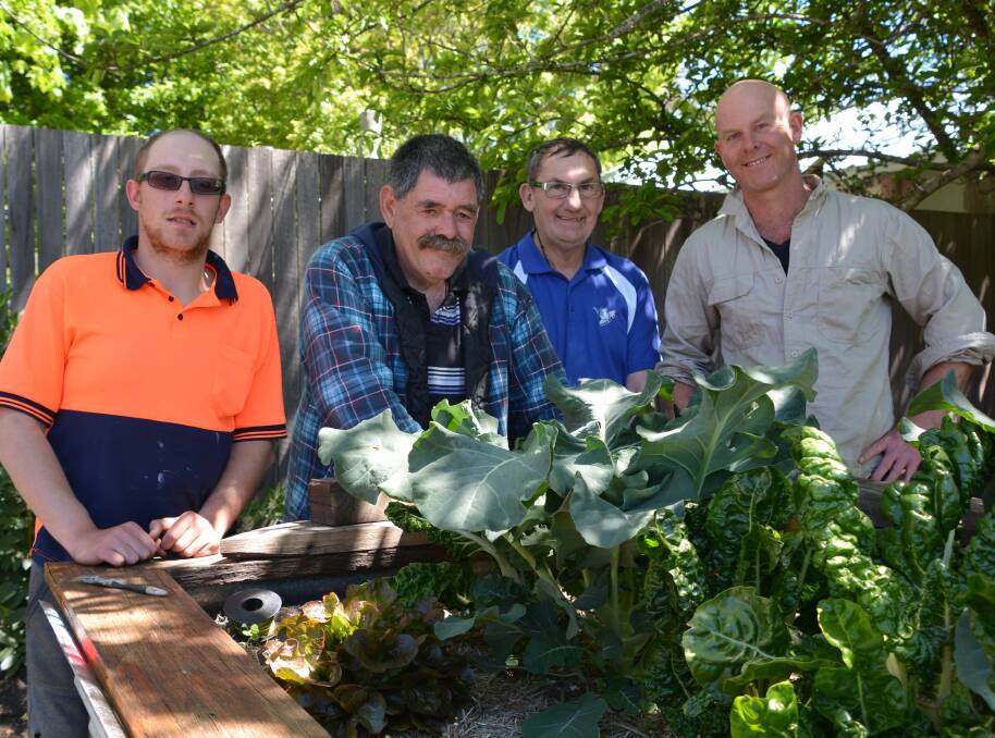 Fruits of their labour: Josh Abbott, Chris Sullivan, Bruce Green and Kirinari lifestyle manager Daniel Sepetauc by the produce grown at Blackheath.