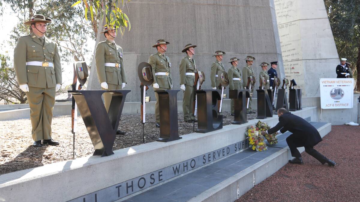 Former Prime Minister Tony Abbott laying a wreath at the Vietnam Veterans Day commemoration ceremony at the Australian Vietnam Forces National Memorial in Canberra last year. Photo: Andrew Meares