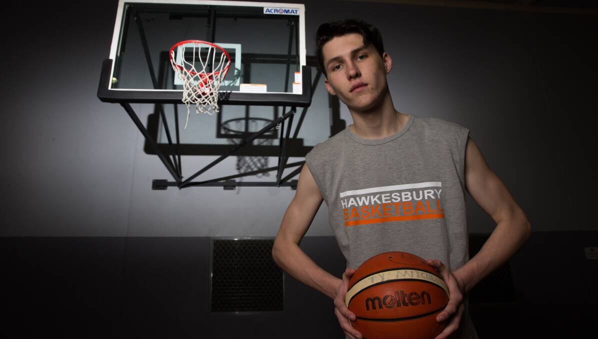 Tons of talent: Ty Mitchell has gone from shooting the occasional hoop in his backyard to earning a scholarship to an American basketball academy. Picture: Geoff Jones 