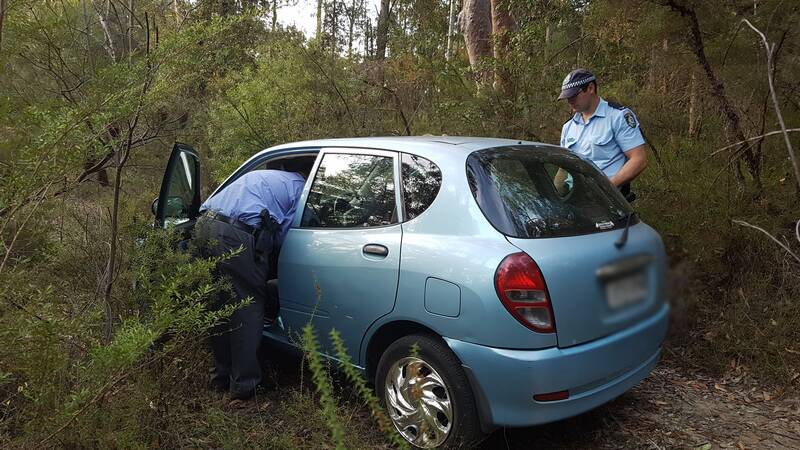 A blue Daihatsu Charade believed to be connected with the alleged robberies was found in Springwood.