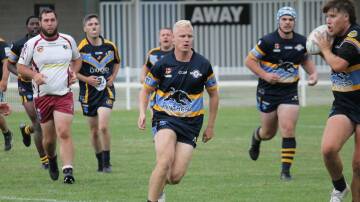 Blake Maher, centre, in action for CSU Mungoes at Blayney on March 23. Picture by John Fitzgerald