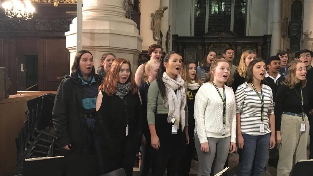 On song: Eliza in action (seventh from left in scarf) at Christ Church Cathedral in Dublin.
