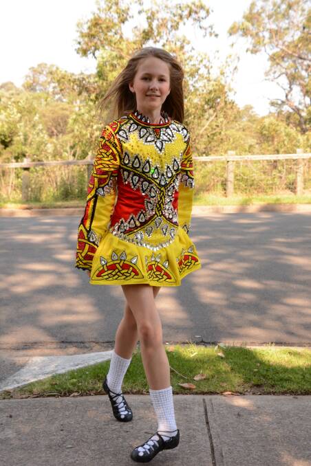 Fancy footwork: Springwood's Georgie Purcell, 12, in the dress she will wear as an Australian representative at the 2016 Irish Dancing world championships.