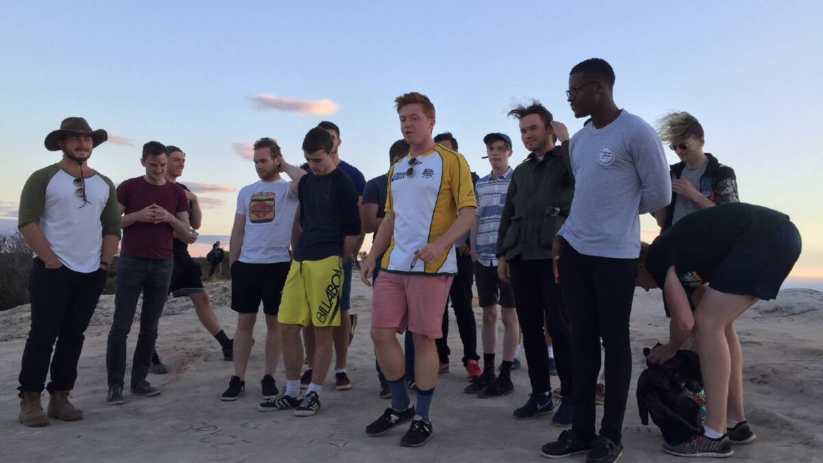 Not expecting that!: An all-male a capella group made up of Trinity College, Dublin, students and graduates on their Australian tour, “Land Downunder" are seen here at Lincoln Rock, in Wentworth Falls. Photos:  Anne McLeod.