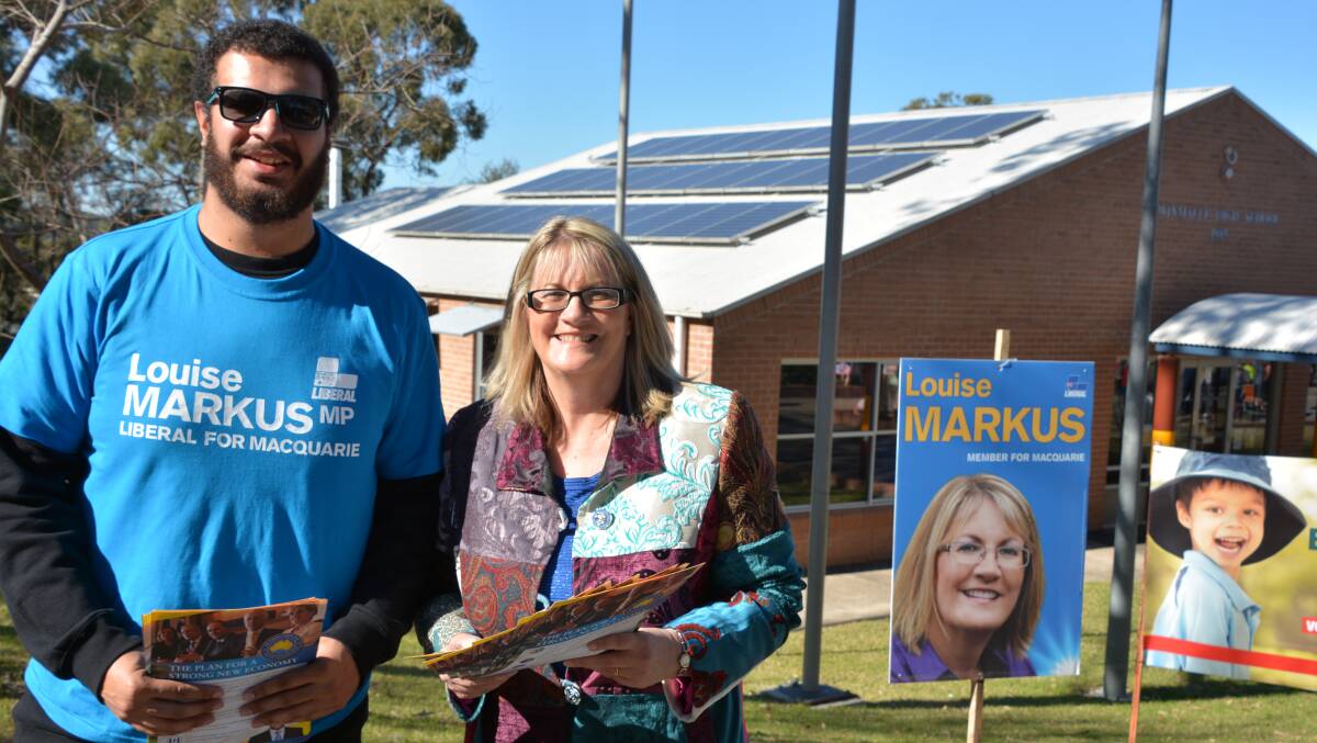 Former Federal Member for Macquarie Louise Markus with her son Joshua at Winmalee High School on election day.