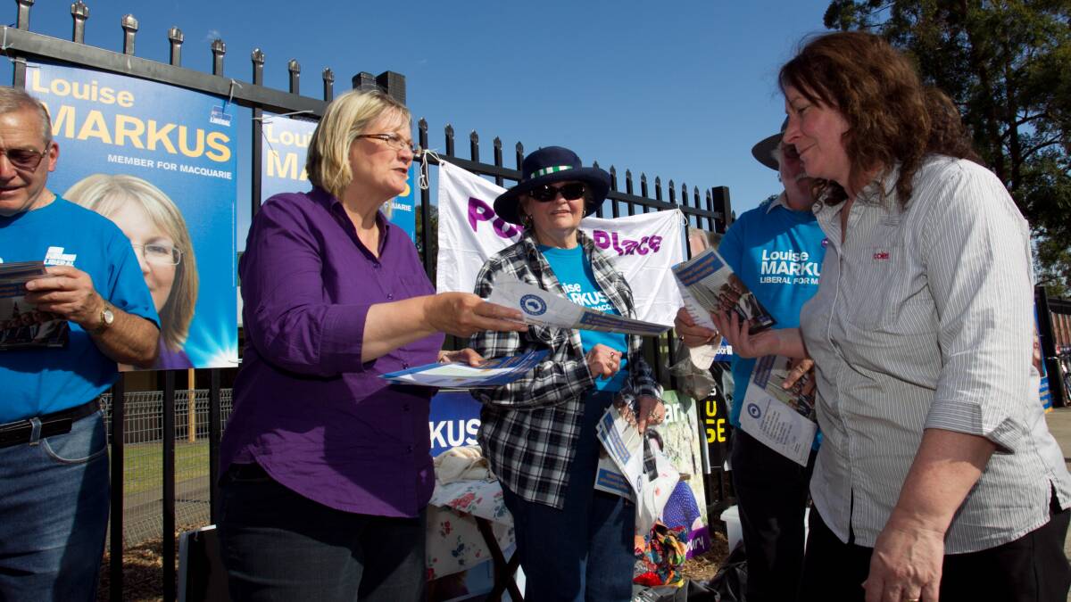 Liberal Member for Macquarie, Louise Markus, hands out how to vote forms outside Hobartville Public School on September 7, 2013. Photo: Geoff Jones.