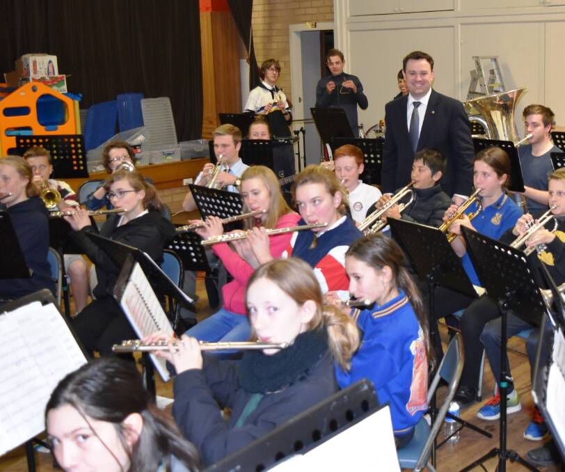 Musical talent: Penrith MP Stuart Ayres (centre) with members of Blue Mountains Youth Concert Band 