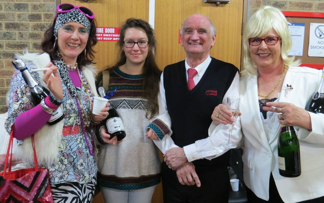 Some of the successful patrons who dressed brilliantly for last year’s charity screening of Absolutely Fabulous, pictured with cinema proprietor Ron Curran.