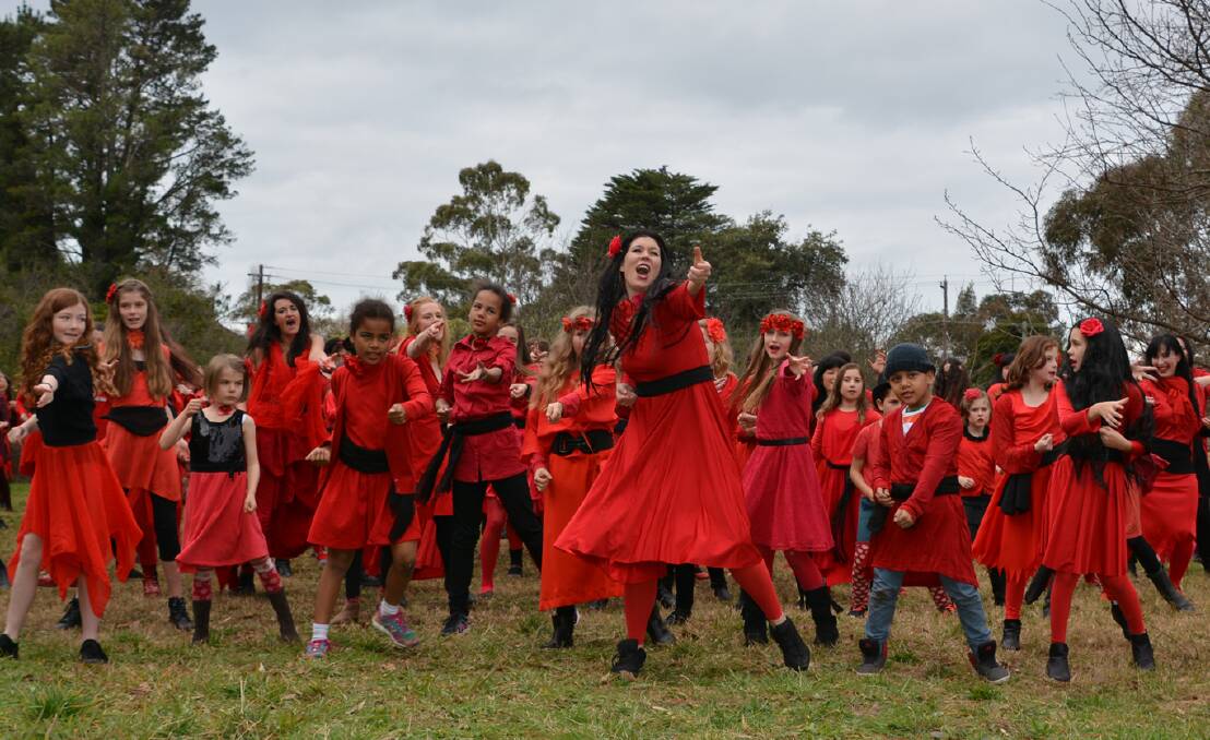 It's me, Cathy: Dance teacher Georgina Khoo leads the sea of Kates in a recreation of the Wuthering Heights music video at Woodford.
