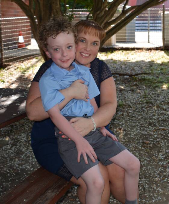 Miracle baby: Deana Gibbons with her son Callum who started school in Springwood last month.