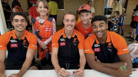GWS Giants players, from left, Joe Fonti, Ryan Angwin and Callum Brown with young Blue Mountains players Lucille and Felix Craye at Faulconbridge on March 27. Picture supplied