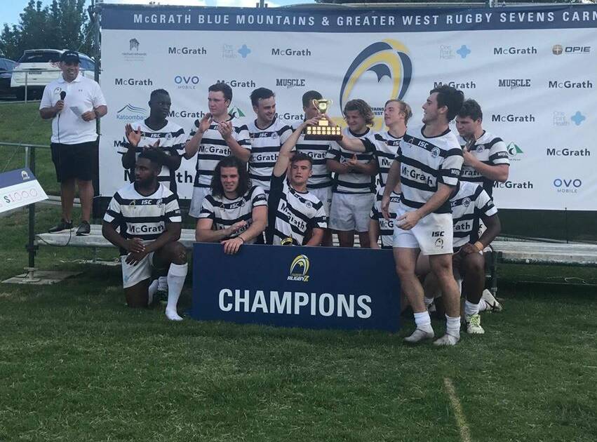Players from Stannies Old Boys at Bathurst celebrate after winning the inaugural Blue Mountains and Greater West Rugby Sevens Carnival Cup.