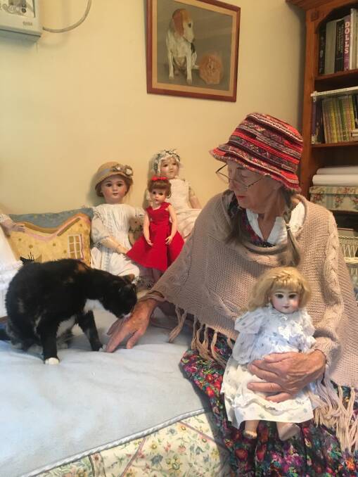 Surprising lives exhibitor Anita Walton with her collection of antique dolls 
