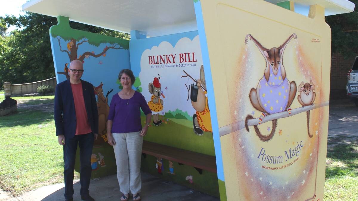 Proud artist: Jayne Shephard shows Mayor Mark Greenhill the finished product of the new ‘Blinky Bill’ mural on the iconic Glenbrook bus stop.