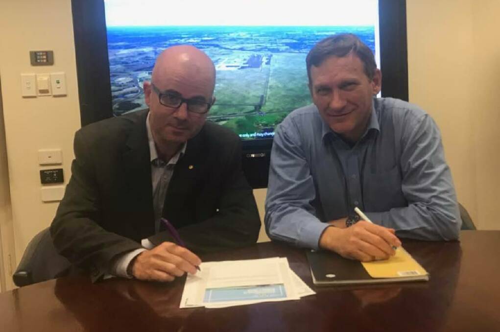 Blue Mountains mayor Mark Greenhill and Blacktown mayor Stephen Bali in front of a picture of the Western Sydney Airport site at Badgerys Creek.