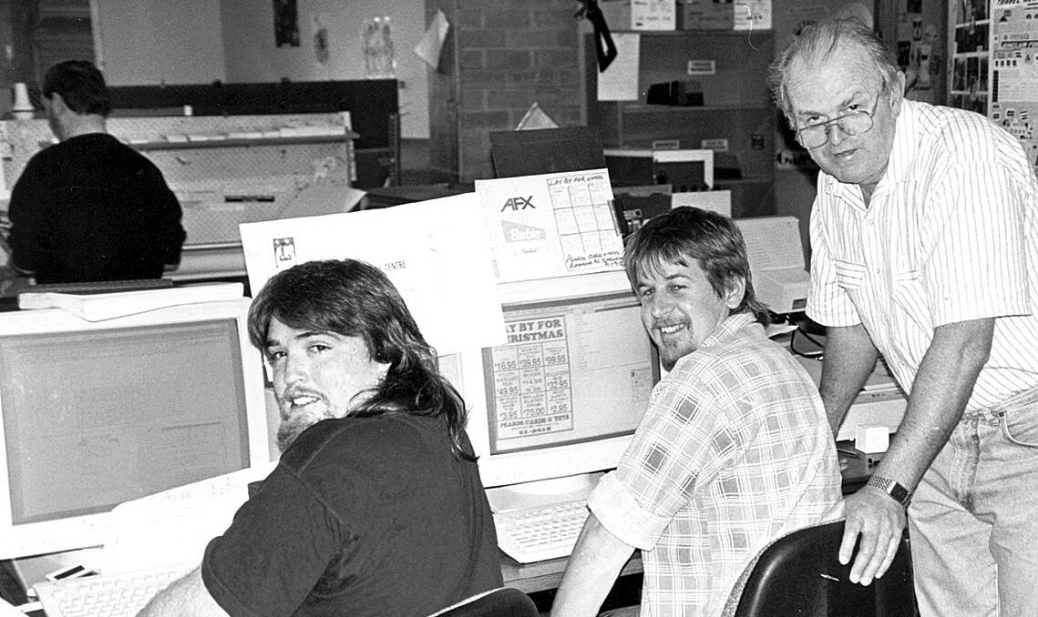 Newspaper man: Mick Ticehurst (right) with former Blue Mountains Gazette production staff Scott Drury and Andrew Buckle at the Gazette’s Springwood office in the 1980s.