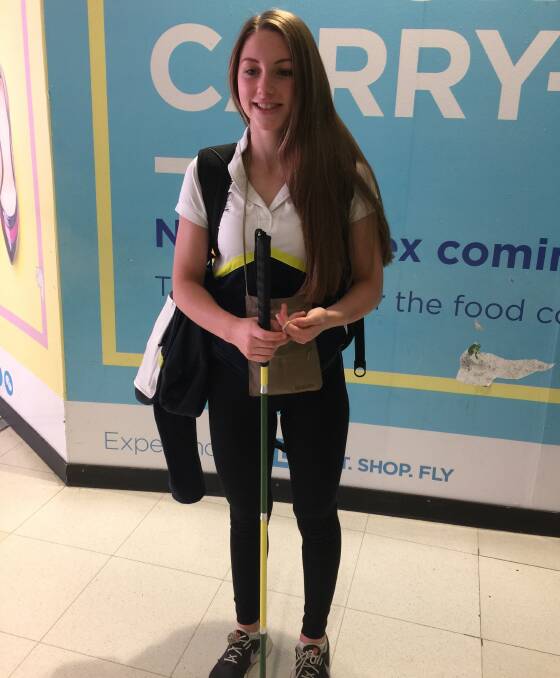 Paralympian Jenna Jones with her green and gold cane.