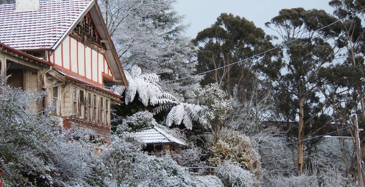 Tranquil: In echoes of a northern hemisphere winter, snow covered this home in Katoomba on Friday. Photo: Sousau Ello