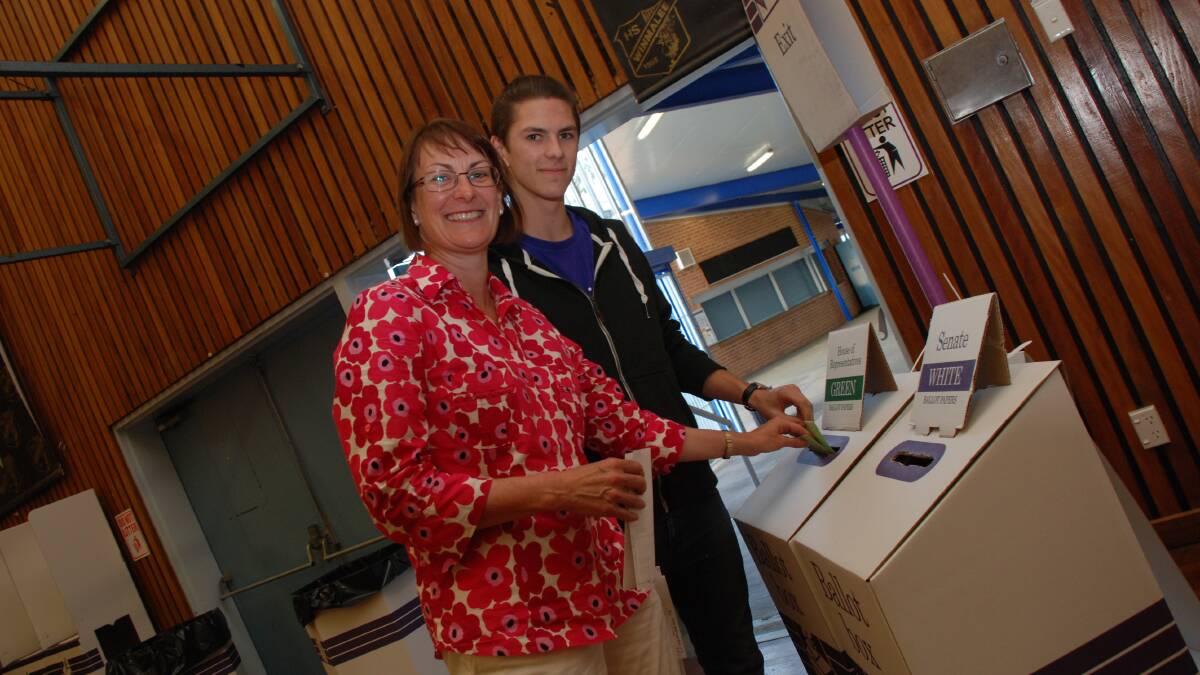 Labor candidate for Macquarie Susan Templeman votes at Winmalee High School with her son Harry in 2013. Photo: B. C Lewis