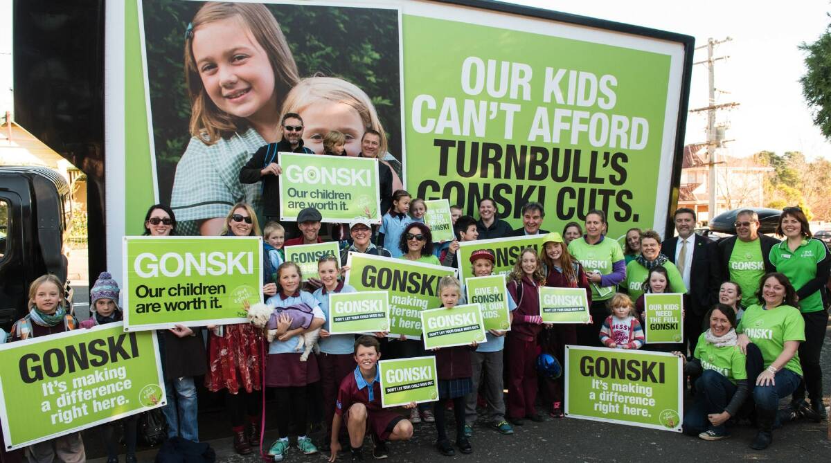 Taking a stand: Gonski education supporters in front of the NSW Teachers Federation Gonski billboard at Katoomba on Monday.