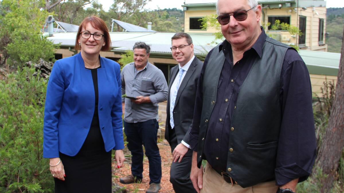 Solar focus: MP for Macquarie Susan Templeman and Shadow Assistant Minister for Energy and Climate Change, Pat Conroy, with Damian McMahon of Blue Mountains Solar and Hazelbrook resident Bernd Luedecke, looking at solar panels and battery storage for hybrid set-up homes in the Mountains.
 
