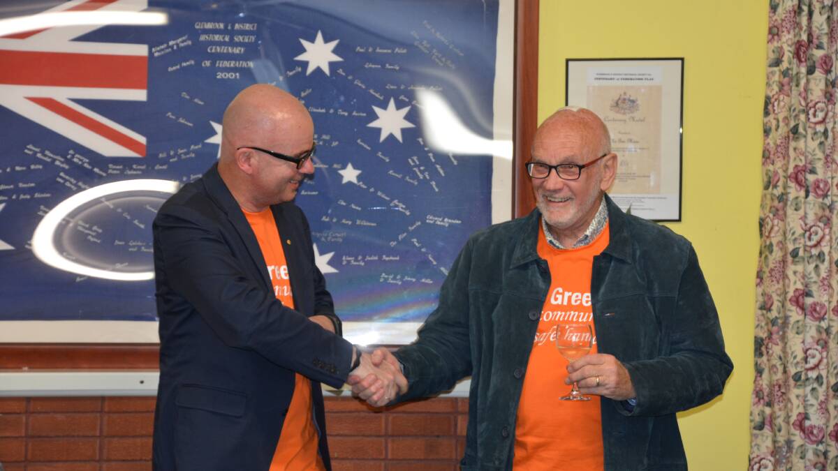 Re-elected Ward 4 Cr Mark Greenhill (left) congratulates the Labor Party's number two candidate in Ward 4, Darryl Bowling, at Glenbrook on Saturday night.