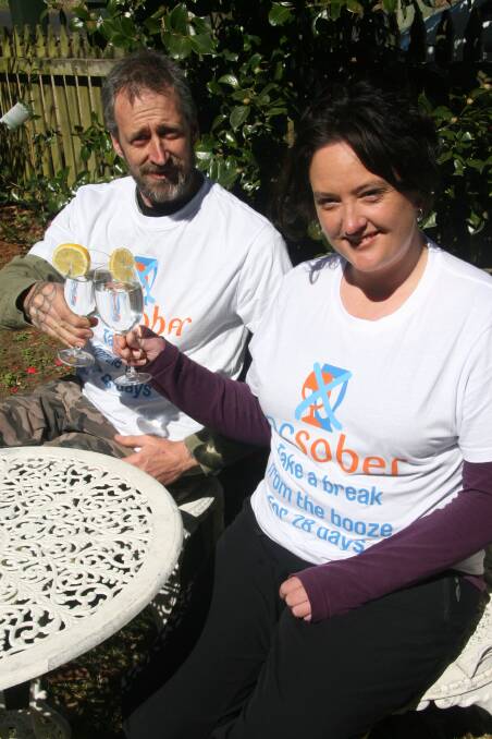 Upper Mountains residents Morgan Boehringer and Amy Bell enjoy a glass of mineral water in preparation for Ocsober.