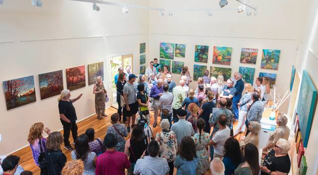 Drawing a crowd: John Ellison speaking at the opening of the Light and Air exhibition at Leura.