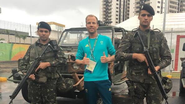 Ben St Lawrence poses with soldiers in Rio on August 11. Photo: twitter.