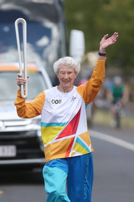 Masters Games medal winner 91 year old Heather Lee carries the Queen's Baton during the Penrith leg of the 2018 Commonwealth Games Queens Baton Relay. Picture: Geoff Jones