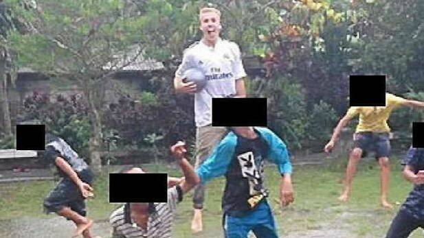 Oliver Bridgeman's Facebook page shows him playing football with children in Bali. Photo: Supplied