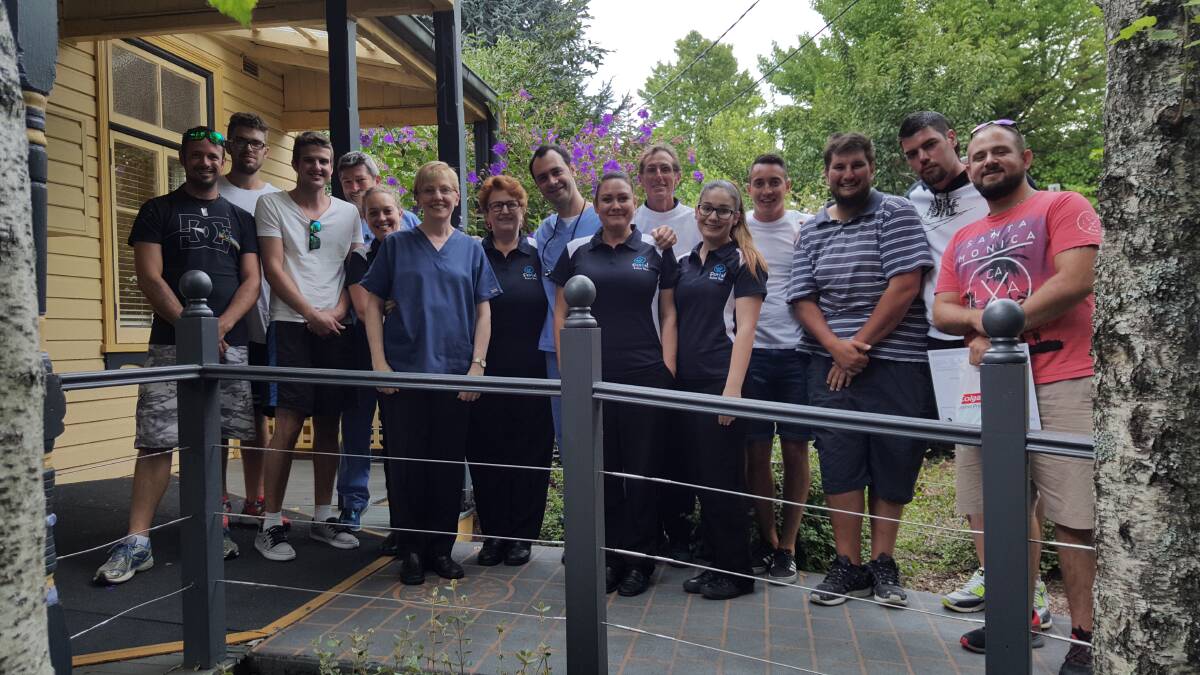 All in a volunteering day's work: Some of the One80tc participants and Leura Dental staff last Tuesday.