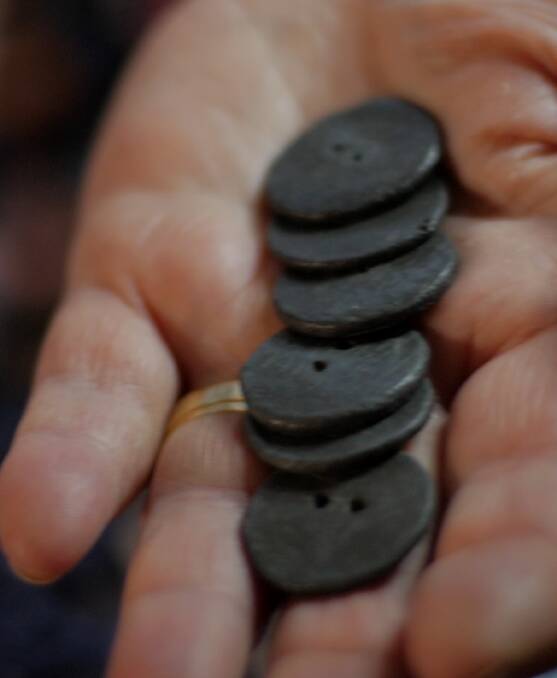 Treasured memento: The original buttons made from bullets 100 years ago during the ceasefire.