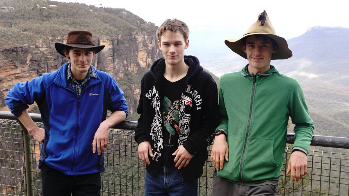 Eco warriors: Kalang, Tallai and Milo Morrison-Jones with Kings Tableland and Mt Solitary in the background.