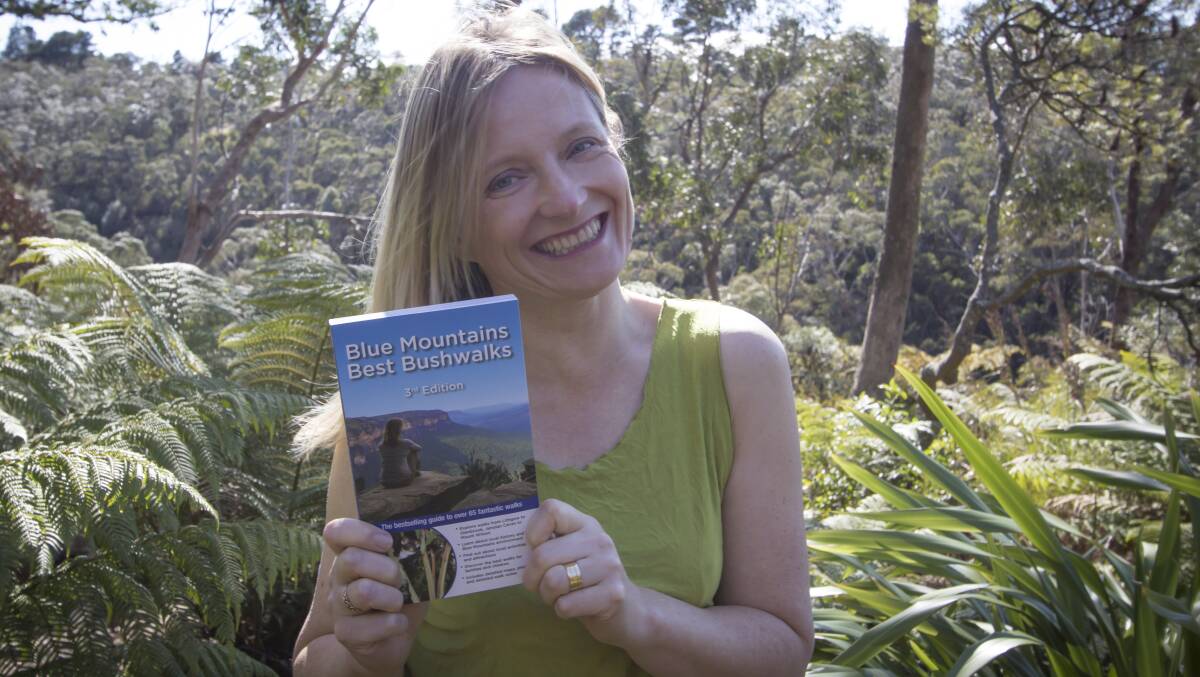 Passionate bushwalker: Veechi Stuart with the newly released 3rd edition of her popular book Blue Mountains Best Bushwalks. Photo from: www.camillewalshphotography.com.au