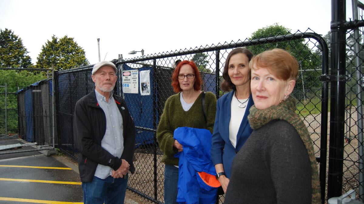 Noise and smell from the temporary generator: Residents living near the Wentworth Falls train station want the state government to "prioritise the power", pictured with Cr Hollywood (second from right).