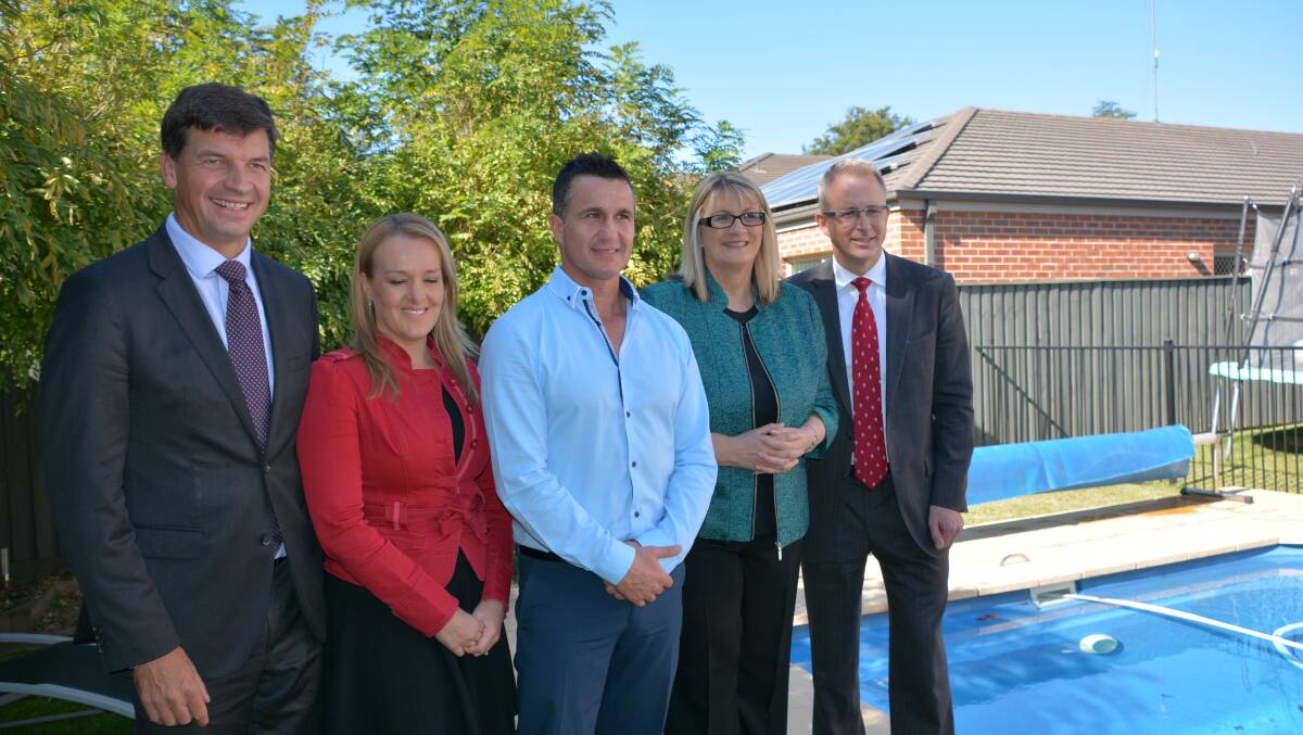 No merge: Minister for Major Projects, Paul Fletcher (right) makes the announcement at Matt Birt's Blaxland home (centre). He is flanked by members Louise Markus (right), Fiona Scott and Angus Taylor (left).