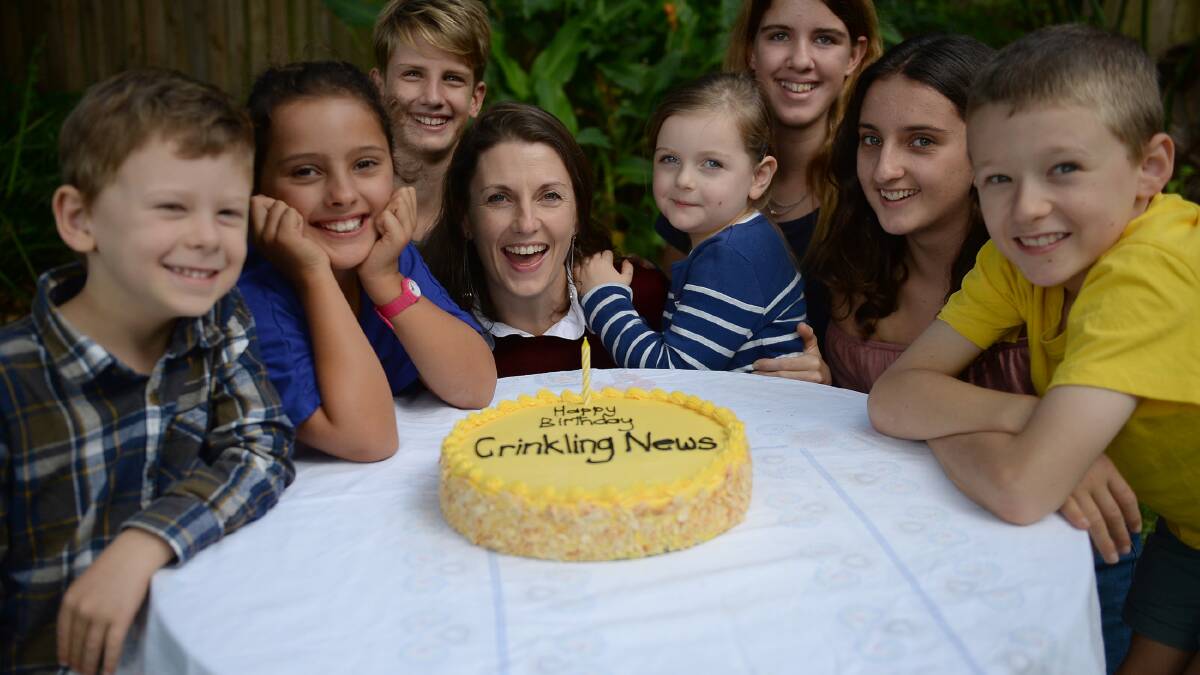 Party time: Crinkling News readers (including editor Saffron Howden and her daughter Peta in the centre) with a celebratory cake from Bakehouse on Wentworth.