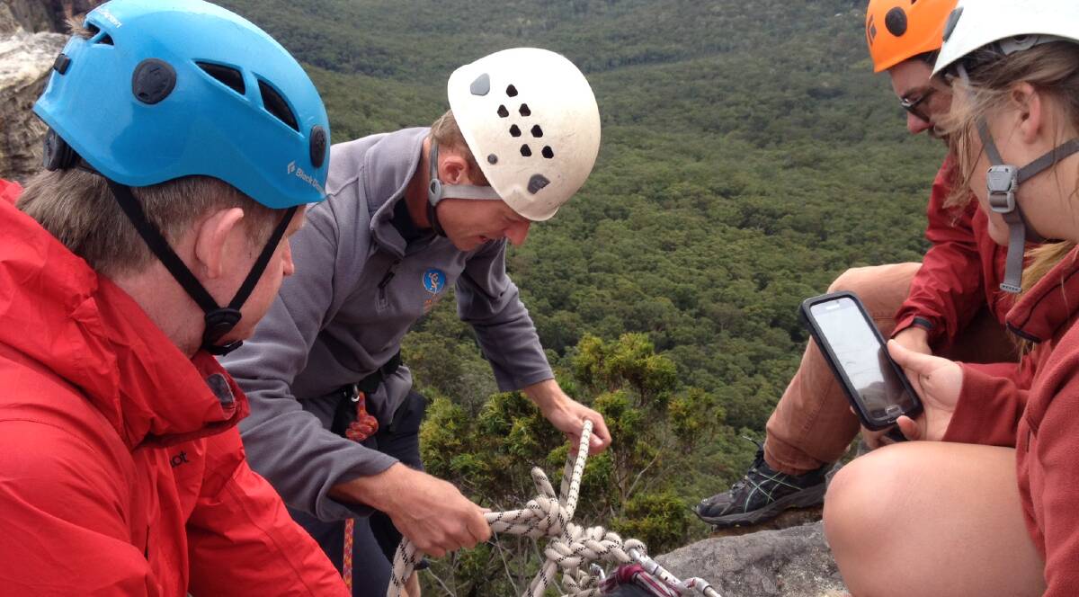 Rigging work: Blue Mountains Adventure Company's Marty Doolan (with rope) gives tips to fellow guides, Nick Byczkov, Hugh Ward and Ashlee Bull.