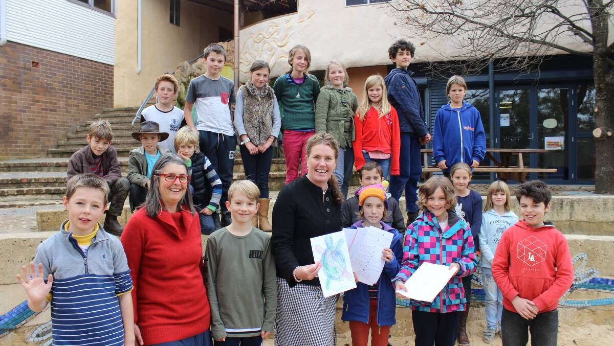 Say no to plastic: MP Trish Doyle receives a petition compiled by students at Kindle Hill School, Wentworth Falls.