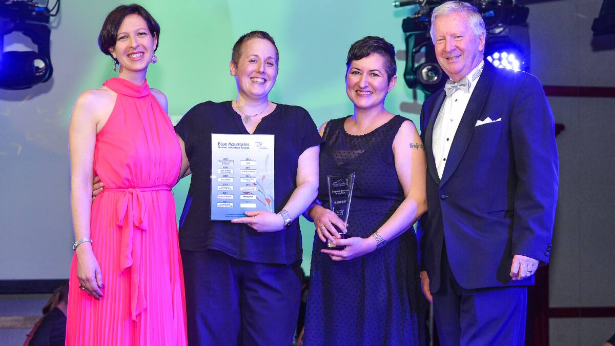 Vegan cafe wins top business award: Scenic World's Anthea and Phil Hammon give the top gong to Rubyfruit owners Amanda Solomons and Simone Bateman (centre).