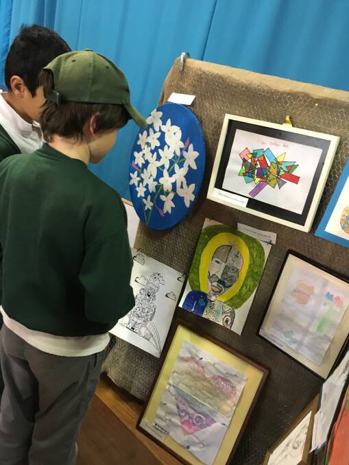 Students admire some clever arty works
